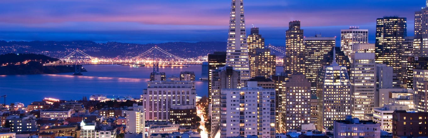 San Francisco city skyline and Golden Gate Bridge at night.